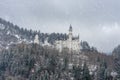Neuschwanstein castle in winter with snow falling beautiful winter landscape Royalty Free Stock Photo