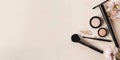 Neutral background with space for text alongside makeup products. Royalty Free Stock Photo