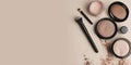 Neutral background with space for text alongside makeup products. Royalty Free Stock Photo
