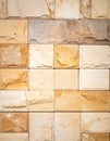 Neutral Beige and Brown Stone Brick Wall with Rough Texture in Sunlight Royalty Free Stock Photo