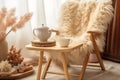 Neutral breakfast still life scene. Blank greeting card, ceramic plate. Vase with dry lagurus bunny tail grass on book