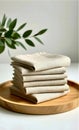 Neutral Linen Napkins Stack on Wooden Tray with Greenery Royalty Free Stock Photo