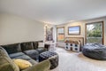 Neutral living room interior with grey corner sofa Royalty Free Stock Photo