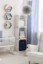 Neutral nursery with cradle and chair Royalty Free Stock Photo