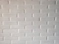 neutral white brick wall. painted many times in white. Background image for a poster. Seamless white brick wall texture Royalty Free Stock Photo