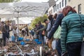 Many customers are interested in bulbs and plants offered at a spring garden market