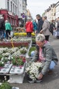 Many customers are interested in flowers and other plants offered at a spring garden