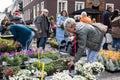 Many customers are interested in flowers and other plants offered at a spring garden