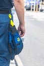 Part of a volunteer of the German `Technisches Hilfswerk` Federal Agency for Technical Relief with the sign `THW` on gloves