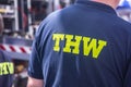 a volunteer of the German `Technisches Hilfswerk` Federal Agency for Technical Relief with the sign `THW` on his back