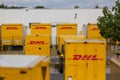 DHL delivery vans and containers in front of a DHL depot Royalty Free Stock Photo