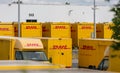 DHL delivery vans and containers in front of a DHL depot Royalty Free Stock Photo