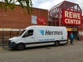 Neuwied, Germany - November 14, 2021: a Hermes delivery van in front of a REWE Center