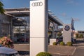 Neuwied, Germany -October 21, 2023: a pylon with the AUDI logo in front of the showroom of the local AUDI and VW car dealer