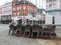 Neuwied, Germany - 20210325: stacked chairs on a rather empty place due to the Corona pandemic