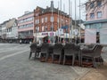 Neuwied, Germany - 20210325: stacked chairs on a rather empty place due to the Corona pandemic