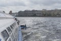 Neva river landscape viewed from a touristic boat on grey day