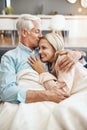 Never cold when Ive got you to hold. an affectionate mature couple relaxing on the sofa at home. Royalty Free Stock Photo