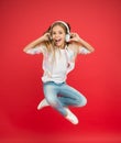 Never ending joy. I believe i can fly. Girl listening music modern gadget. Kid happy with wireless headset dancing Royalty Free Stock Photo