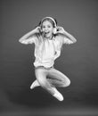 Never ending joy. I believe i can fly. Girl listening music modern gadget. Kid happy with wireless headset dancing Royalty Free Stock Photo