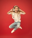 Never ending joy. I believe i can fly. Girl listening music modern gadget. Kid happy with wireless headset dancing Royalty Free Stock Photo