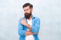 He never give bad advice. Male fashion style. Denim look. serious bearded man. Mature hipster with beard. Anti dandruff Royalty Free Stock Photo