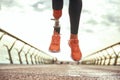 Never give up Cropped photo of disabled woman with prosthetic leg in sportswear jumping on the bridge Royalty Free Stock Photo