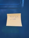 Never give up hope mesage written in a note on a blue mailbox Royalty Free Stock Photo