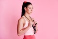 Never give up on what you want. Studio shot of a sporty young woman holding a skipping rope around her neck against a Royalty Free Stock Photo