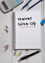 Never give up word on notebook Royalty Free Stock Photo