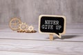 Never give up words written on the chalkboard Royalty Free Stock Photo