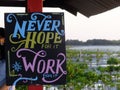Never Hope for it Work for it sign board at the beach stock image
