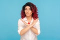 Never, no compromise! Portrait of dissatisfied hipster woman with fancy red hair crossing hands, showing x sign Royalty Free Stock Photo