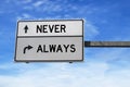 Never and always road sign on blue sky background.. White two street signs with arrow on metal pole. Directional road, Crossroads Royalty Free Stock Photo