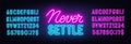 Never Settle neon quote on a brick wall.