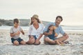 We never stop laughing around our children. Full length shot of a happy couple sitting with their two children who are Royalty Free Stock Photo