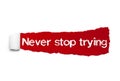 Never stop trying text, Inspiration, Motivation and Business concept on Red torn paper