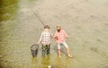 Never Too Far For Family. summer weekend. mature men fisher. male friendship. family bonding. father and son fishing