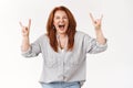 Never too old rock-n-roll. Daring cool redhead middle-aged woman having fun go wild scream out loud positive upbeat mood