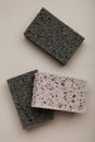 New absorbent black sponge on grey background. Black kitchen sponges Royalty Free Stock Photo