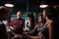 New acquaintances. Beautiful youth have party together with alcohol in the nightclub