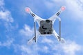 The New Aircraft DJI Phantom 4 pro quadcopter drone with 4K video camera and wireless remote controller flying in the sky. Aerial Royalty Free Stock Photo