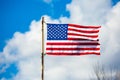 New American flag on an old pole blowing in the wind Royalty Free Stock Photo