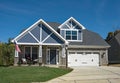 New American Stone Home with Blue Decorative Gables Royalty Free Stock Photo