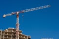 Construction site and a crane with a blue sky Royalty Free Stock Photo