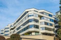 New apartment building on a sunny day with a blue sky. Facade of a modern multistoried new stylish living block of flats