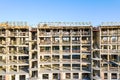 New apartment building under construction against blue sky background Royalty Free Stock Photo