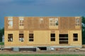 New apartment building under construction on sunny day on blue sky background Royalty Free Stock Photo