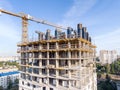 new apartment building under construction and tower crane against blue sky background Royalty Free Stock Photo