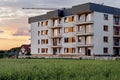 New apartment buildings with balconies on sunset sky background. Royalty Free Stock Photo